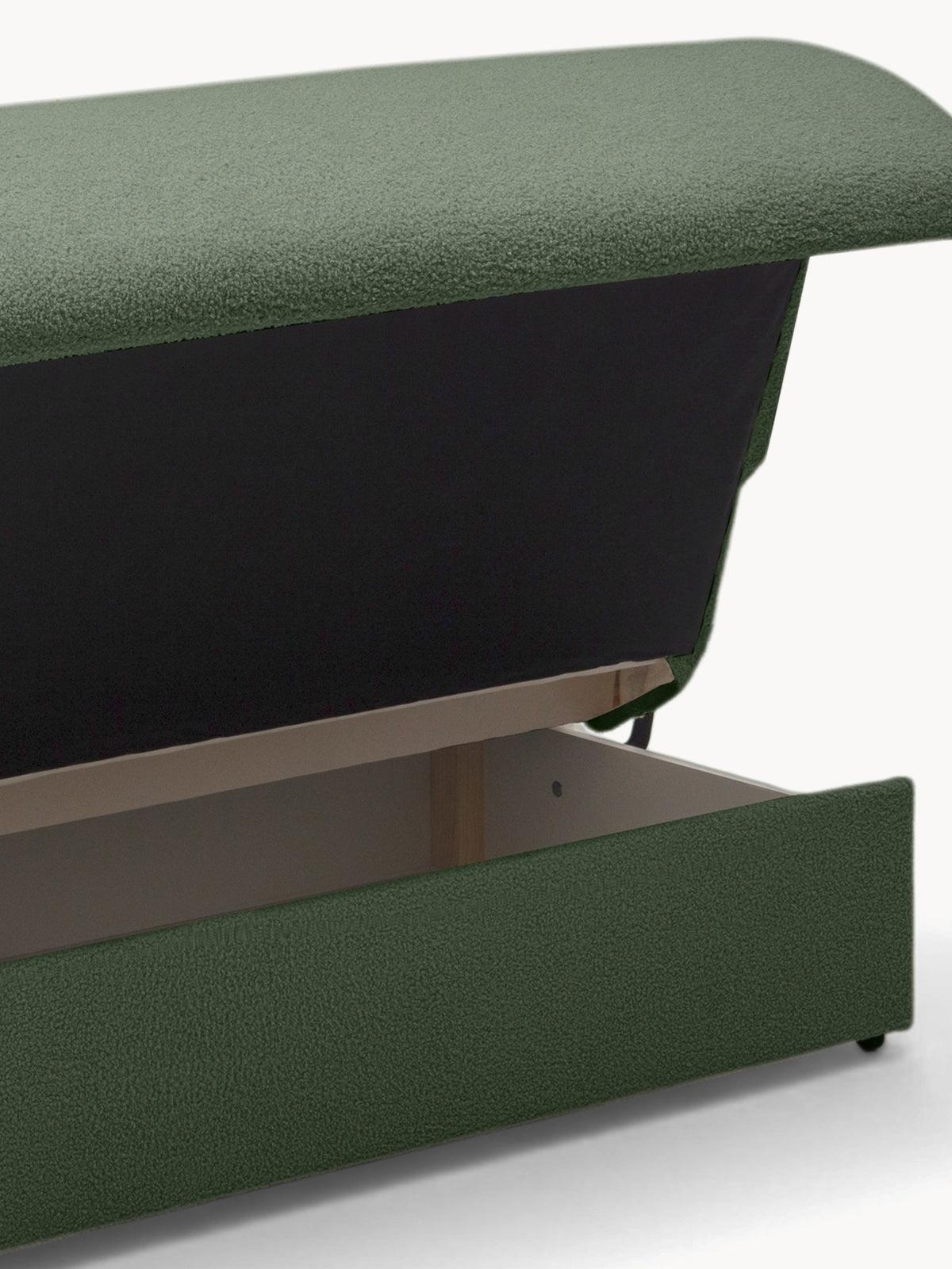 Sofa rozkładana Nido 140 cm zielona boucle z otwartym pojemnikiem na pościel